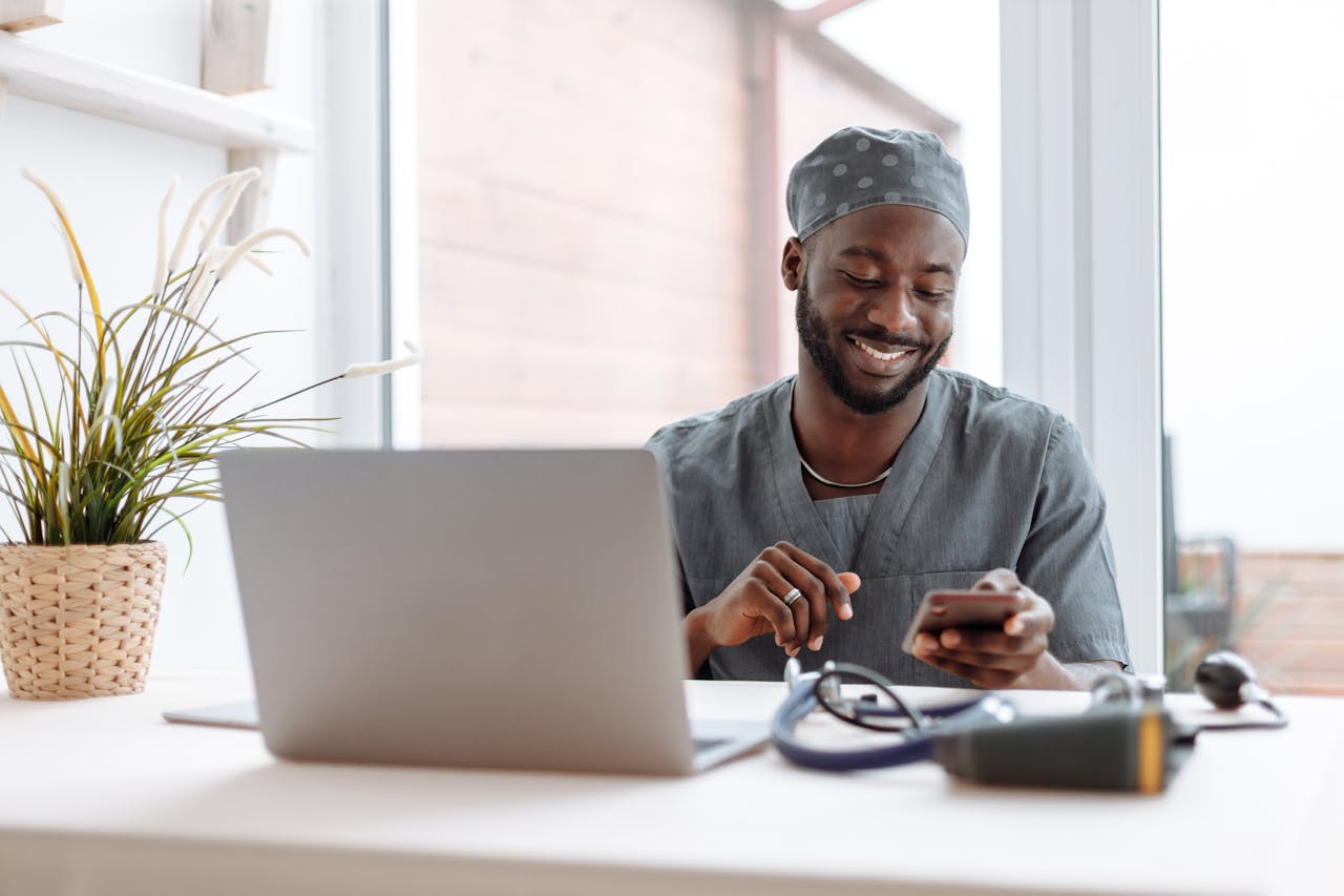 Medical professional using Bitchat Bluetooth messaging app in offline hospital setting