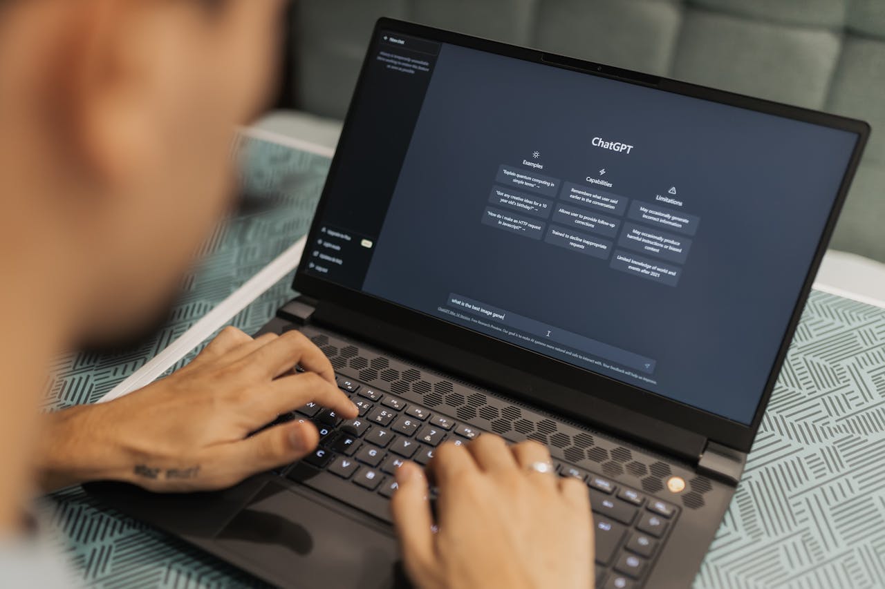 Person using ChatGPT interface on laptop, illustrating AI-powered learning tools