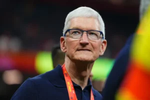 Tim Cook at a public event amid Apple AI leadership changes