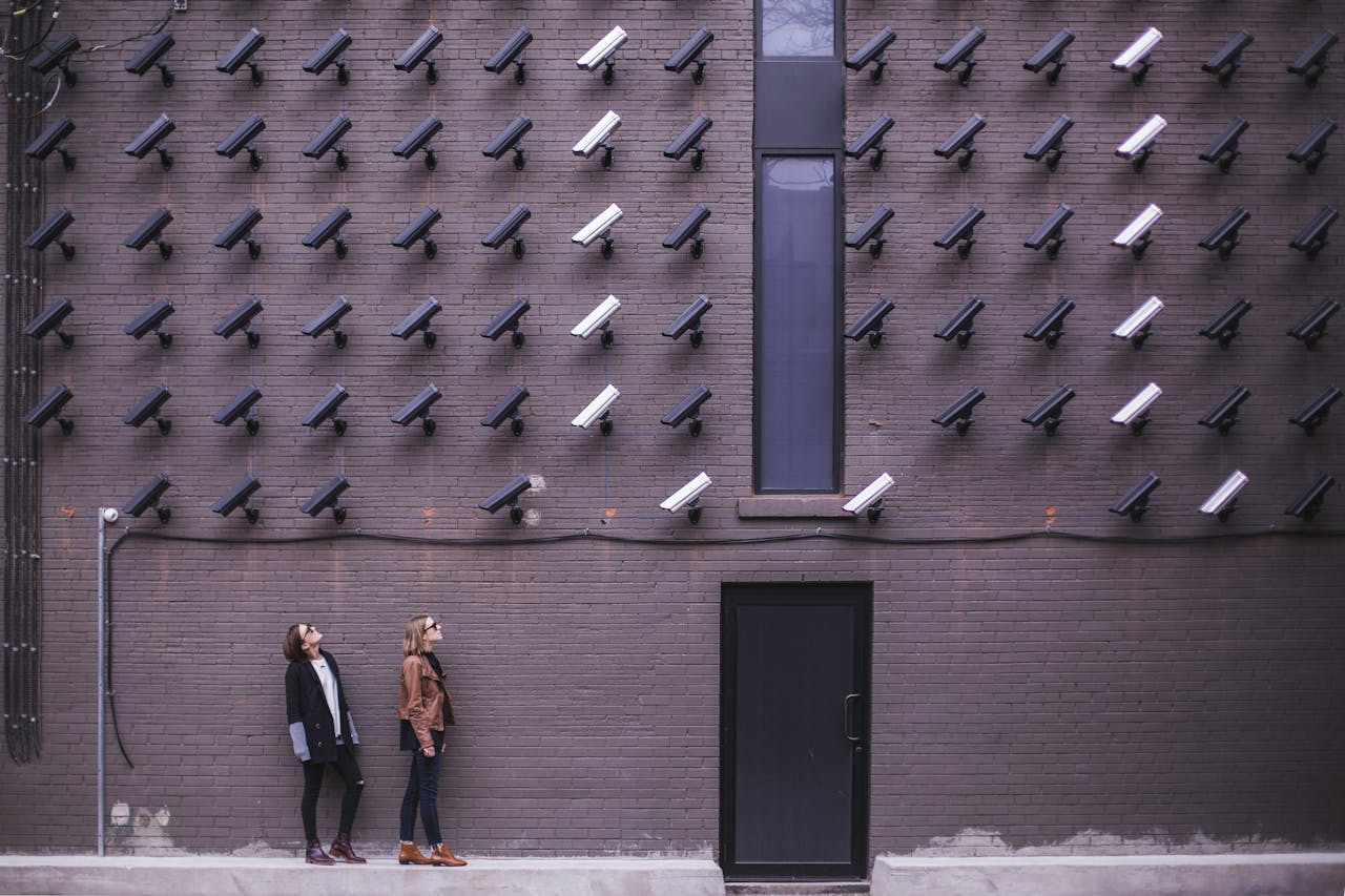 Wall with surveillance cameras symbolizing Meta’s unoriginal content policy enforcement