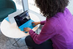 Person using Microsoft Surface laptop in office setting