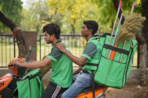 Pronto 10-minute home services workers delivering cleaning tools in Gurugram