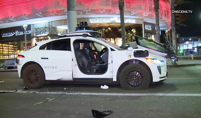 Waymo robotaxi vandalism incident in Los Angeles street at night