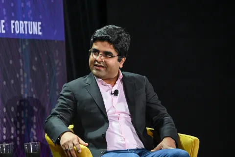 PayPal AI leader discussing intelligence era tokens at industry conference