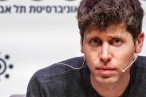 Sam Altman speaking at an event amid the OpenAI app suggestion backlash.