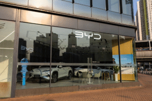 BYD electric vehicles displayed at a showroom in China as the automaker records slower sales growth in 2025