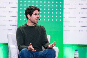 Early-stage venture investor speaking on seed strategy and startup funding trends during a technology conference