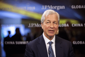 Jamie Dimon speaking at a JPMorgan global summit amid strong 2025 stock gains