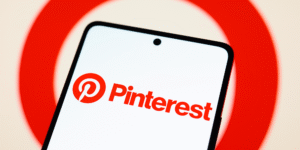 Pinterest logo displayed on a smartphone as the company announces layoffs and shifts resources toward AI initiatives