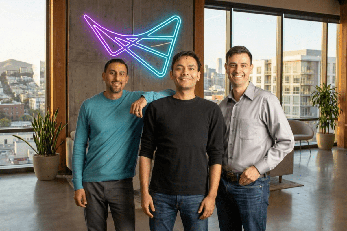 Founders of an AI chip IP startup standing in a modern office focused on on-device AI inference