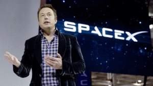 Elon Musk speaking in front of SpaceX branding amid reports of a potential June SpaceX IPO