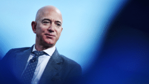 Technology company founder speaking during a public event amid record stock market gains