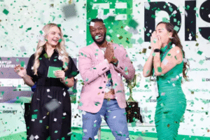 Startup founders celebrating on stage during a major tech industry event, highlighting momentum around technology IPOs and venture-backed companies.