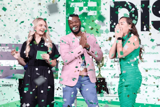 Startup founders celebrating on stage during a major tech industry event, highlighting momentum around technology IPOs and venture-backed companies.