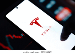 Tesla logo displayed on a smartphone screen representing Tesla Dojo3 space-based AI compute strategy