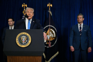President Donald Trump speaks at a podium with U.S. officials during a policy announcement on national security and technology.